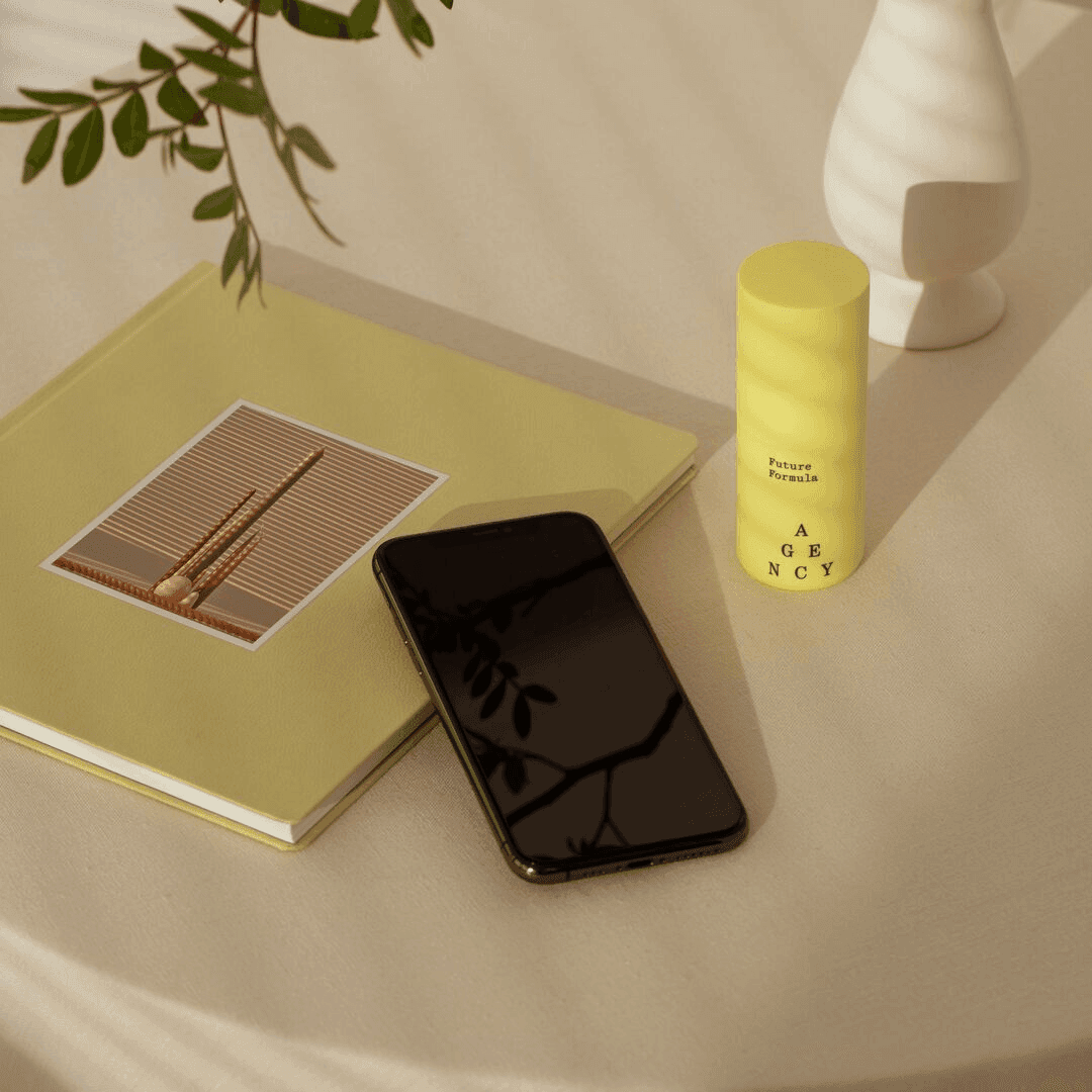 Future Formula bottle with phone and book